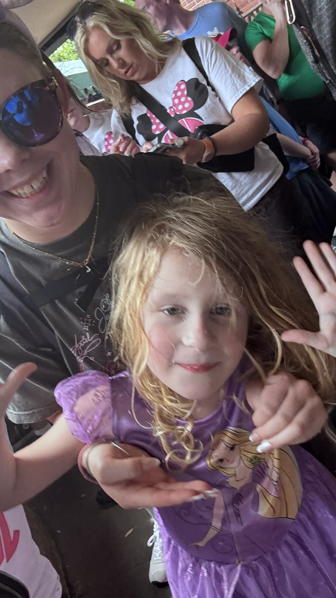 Selfie with daughter in a Rapunzel dress at Magic Kingdom