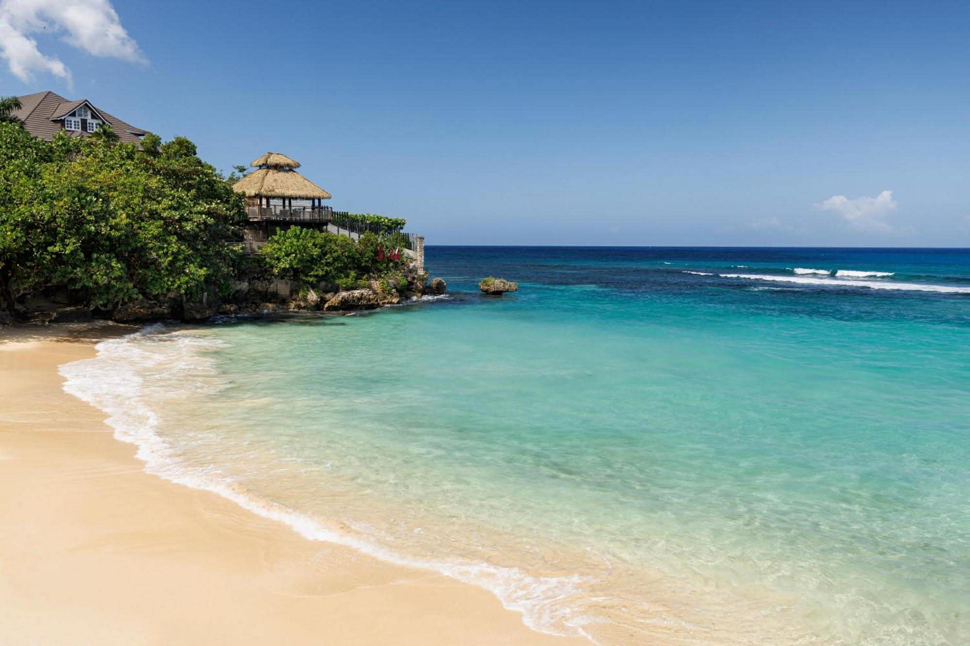 Turquoise cove and white sand beach at a Caribbean all-inclusive resort